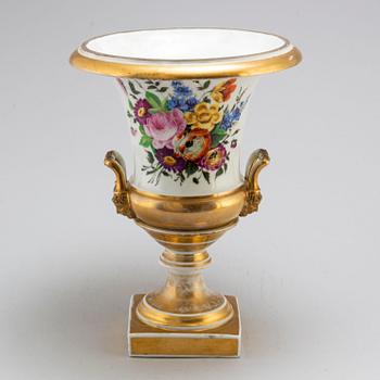 An empire porcelain urn, early 19th century.