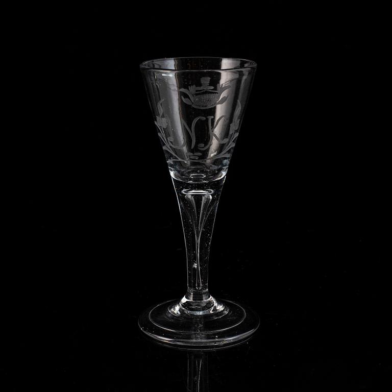 A wine glass, 18th Century, with the monogram NK beneath a noble coronet.