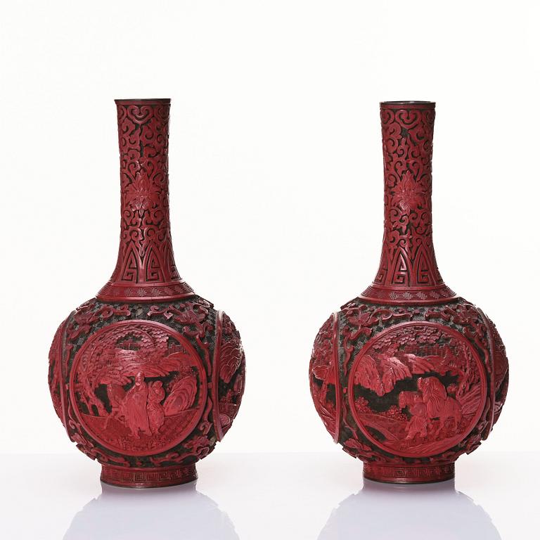 A pair of red lacquer vases, Qing dynasty (1644-1912).