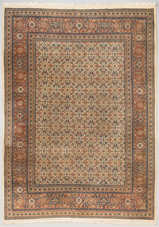 An oriental carpet. Circa 345x245 cm.
