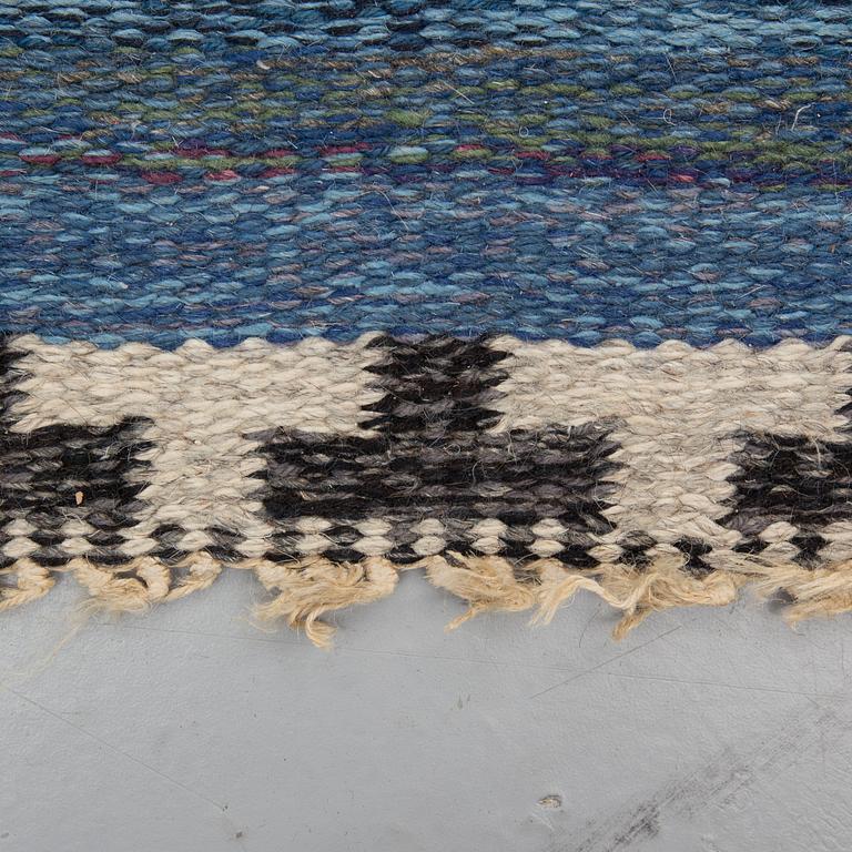 A CARPET, flat weave, atributed to Rakel Carlander, around 306 x 197 cm.