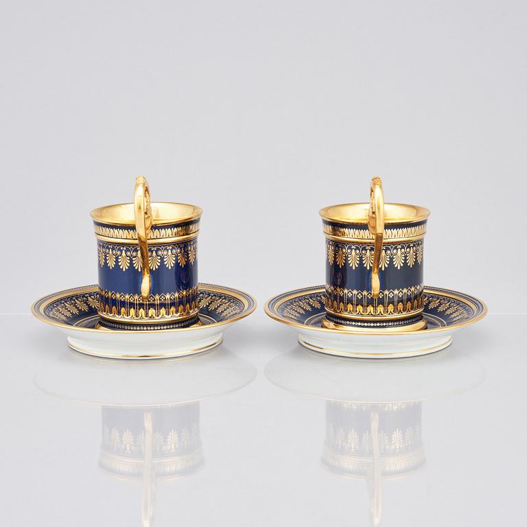A pair of Sèvres cups with stands, 19th Century.