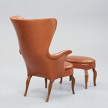 Frits Henningsen, an oak highback chair and ottoman, Denmark 1940's.