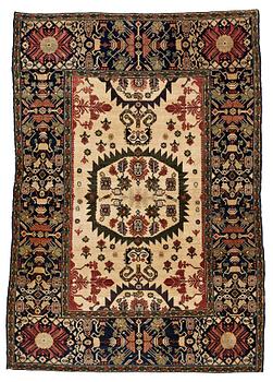 221. A RUG, an antique Malajir probably, ca 179,5 x 124 cm (as well as one end with 2½ cm flat weave).