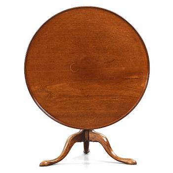 74. An English 18th century tilt top table.