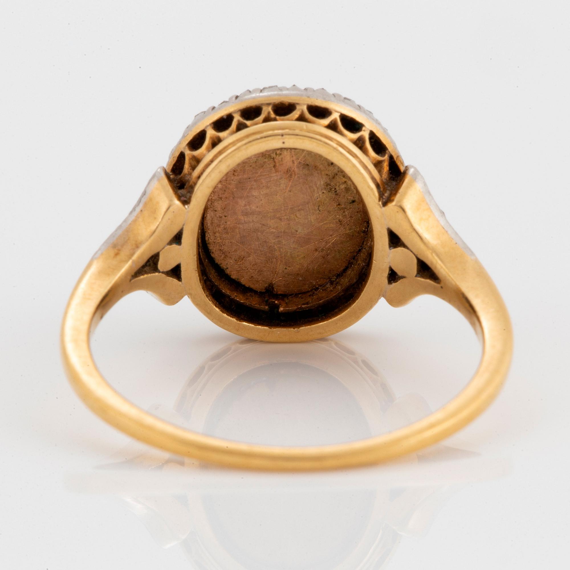 A miniature portrait ring.