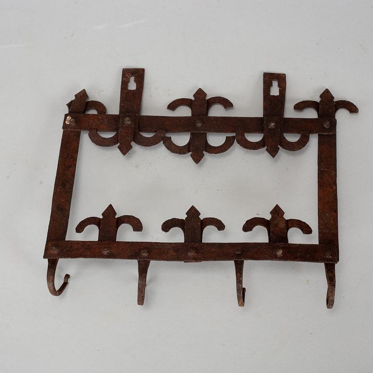 An 18th century iron wall hanger.