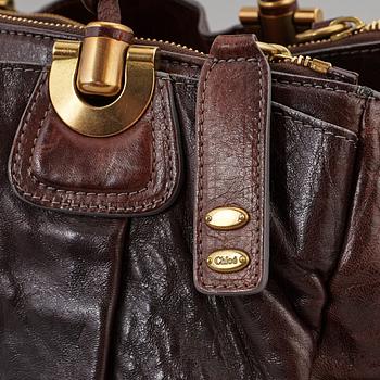 CHLOÉ, a brown leather bag.