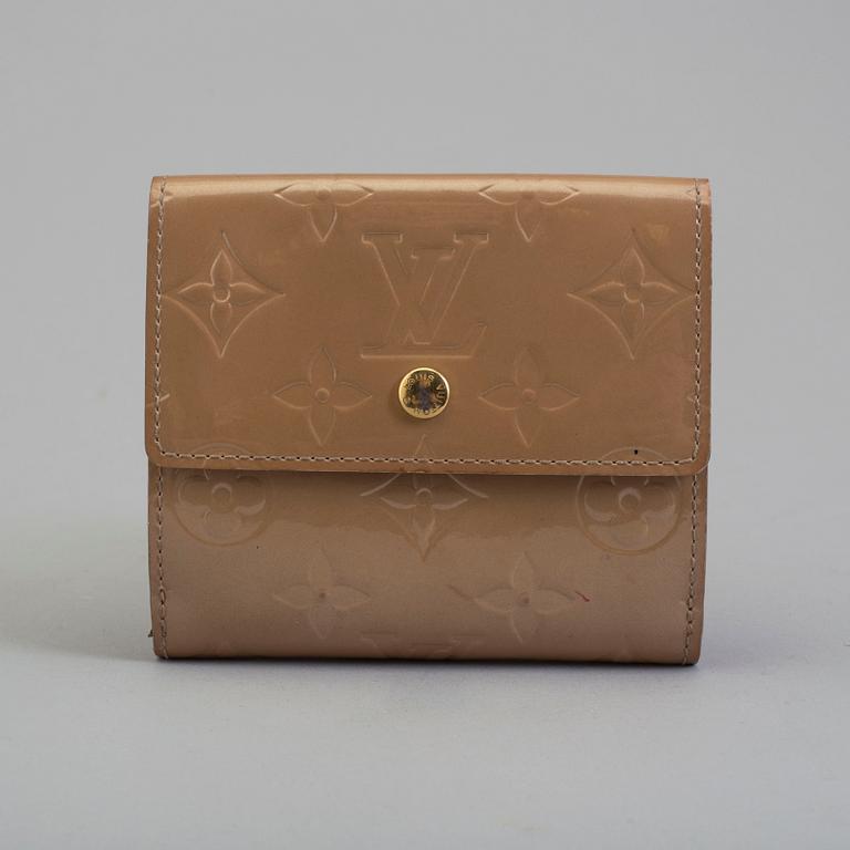 A beige monogram vernis wallet by Louis Vuitton.