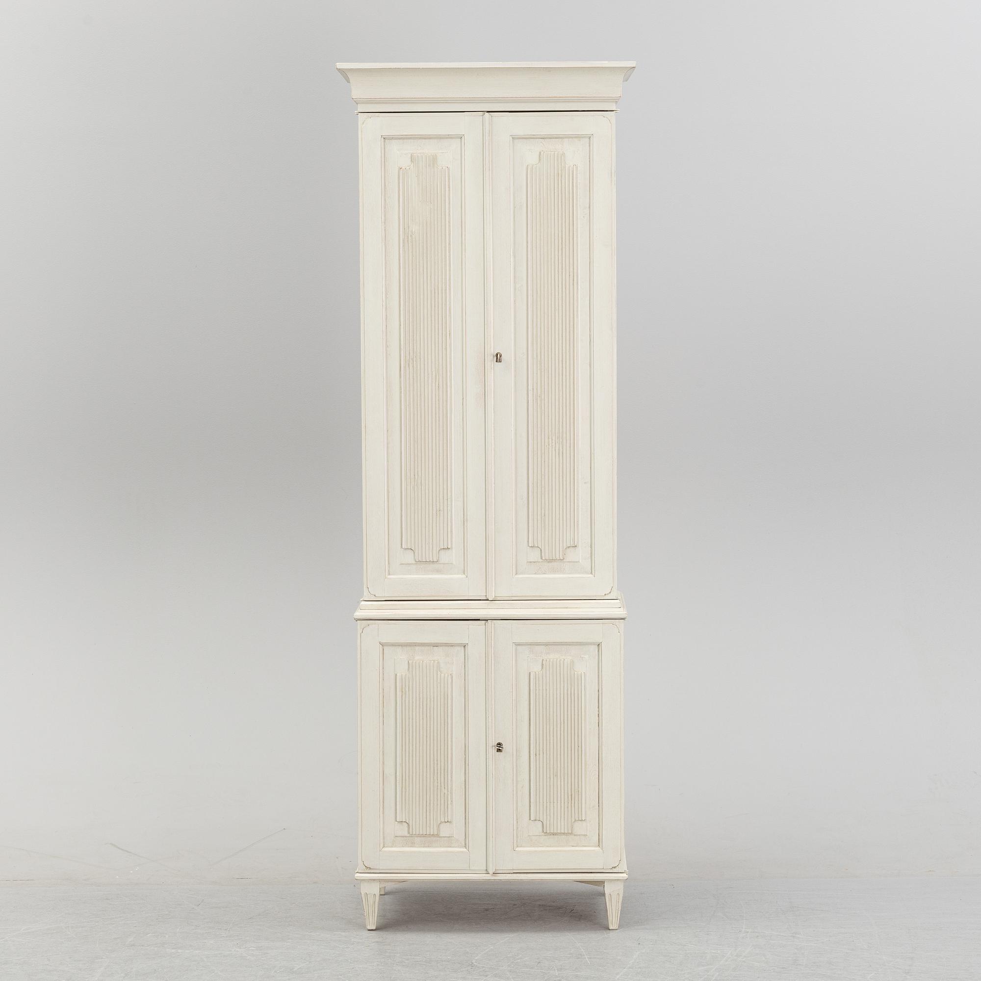 A contemporary Gustavian style cabinet.