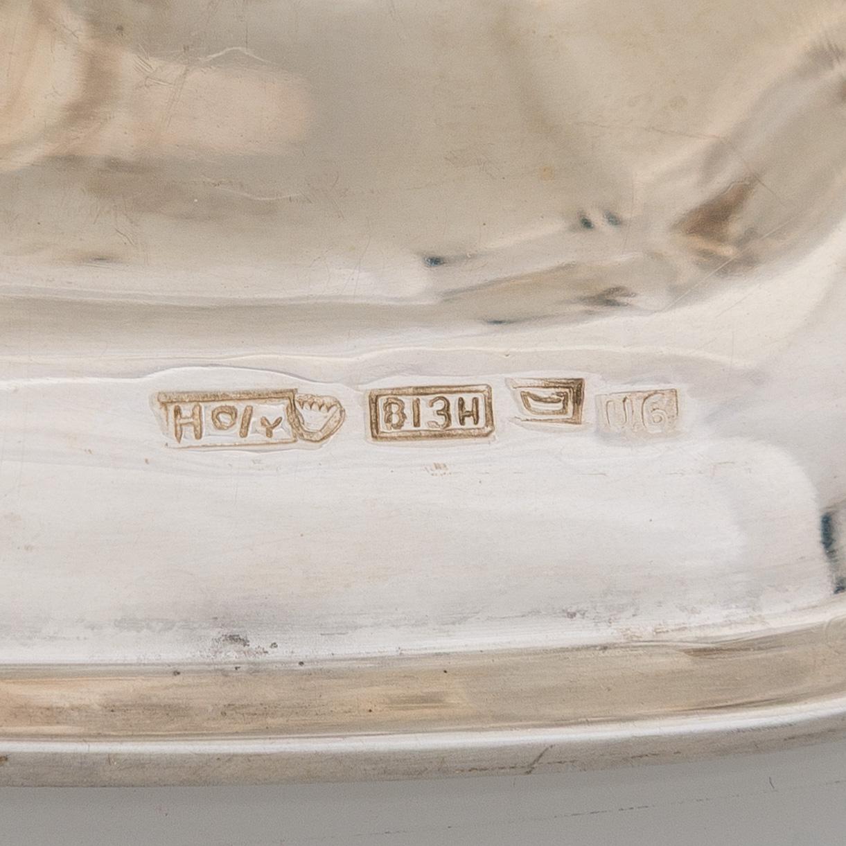 A silver coffee pot, sugar bowl, cream jug, and sugar tongs, Finland 1926-49.