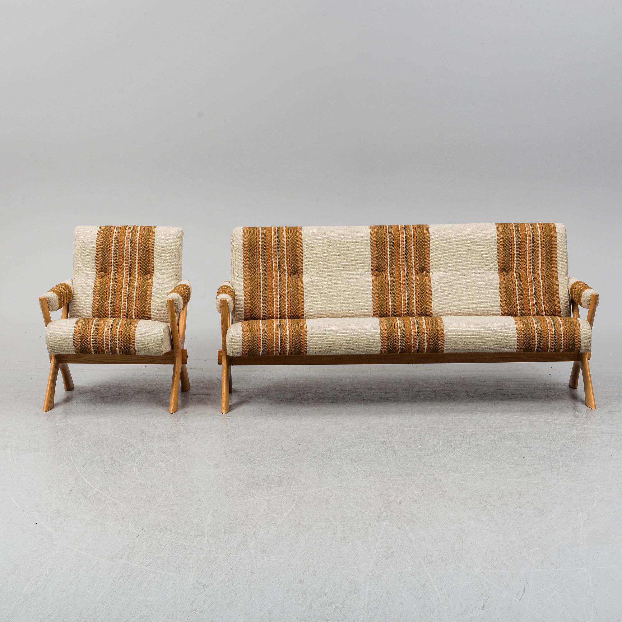A 1960/70's pine sofa, armchair and coffee table.