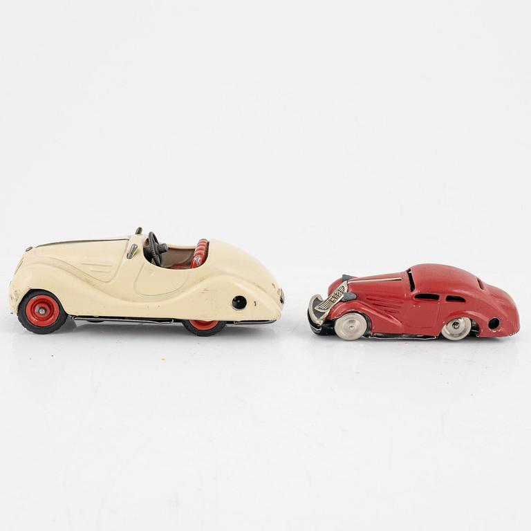 A set of five toy cars, mostly Schuco, Germany.