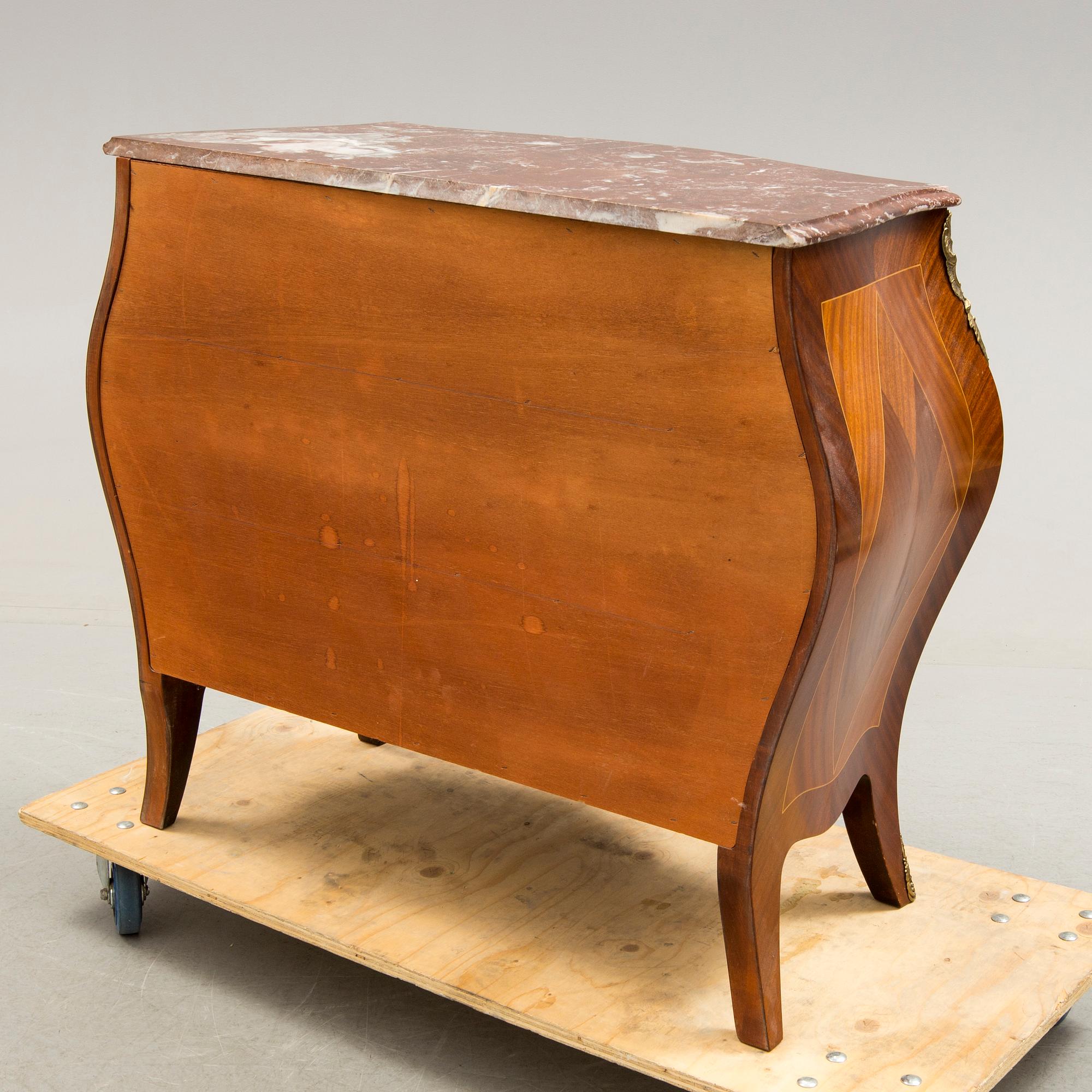 A Rococo-style chest of drawers, mid 20th century.