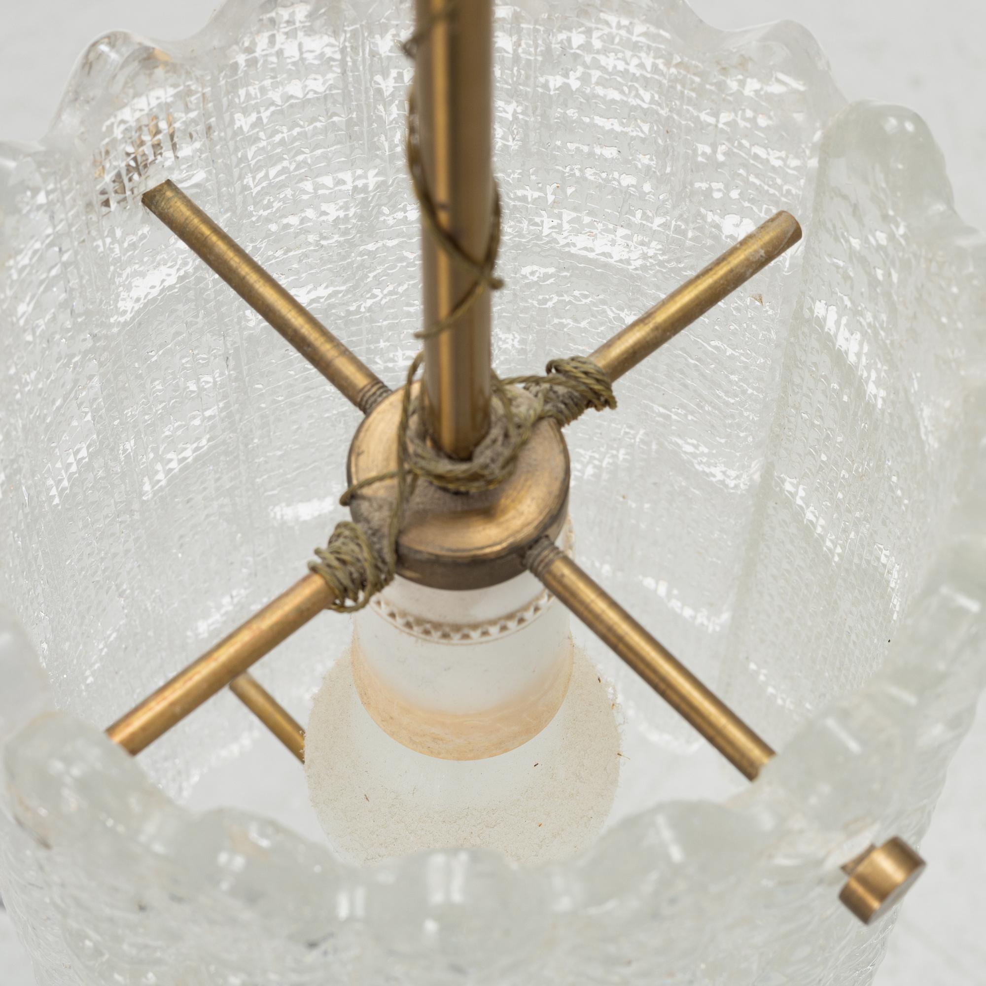 Carl Fagerlund, a pair of brass and glass wall lights and a ceiling light, Orrefors.