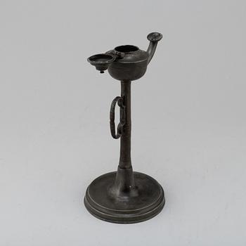 An 18th century pewter oil lamp.