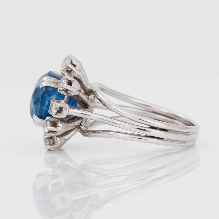 A sapphire and brilliant-cut diamond ring.