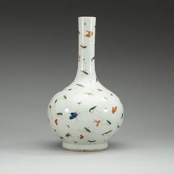 A Chinese butterfly and cricket vase.