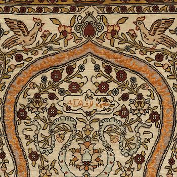 A silk Hereke possibly, around 96 x 66 cm.