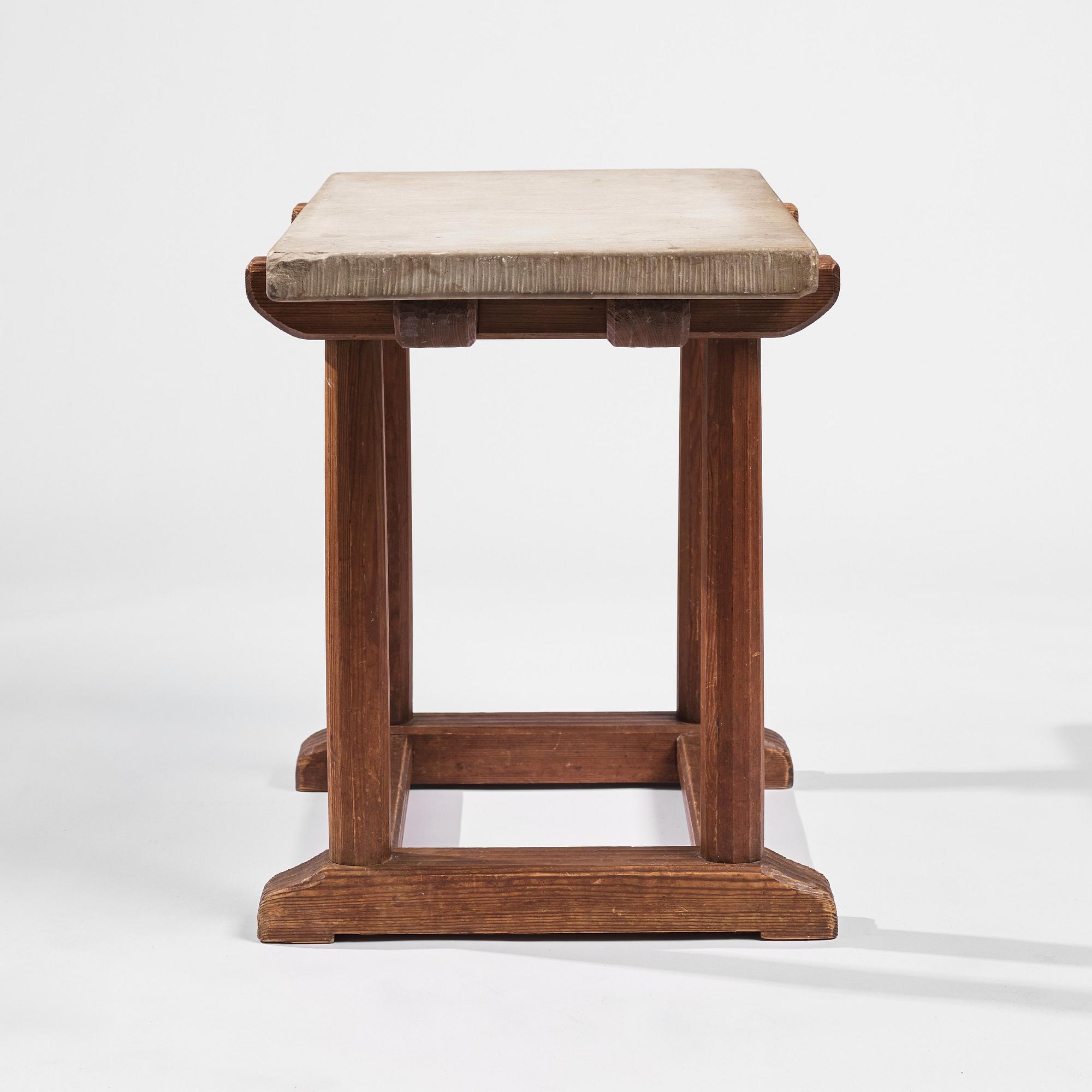 Axel Einar Hjorth, a stained pine and limestone top "Sandhamn" table, Nordiska Kompaniet, Sweden 1931.