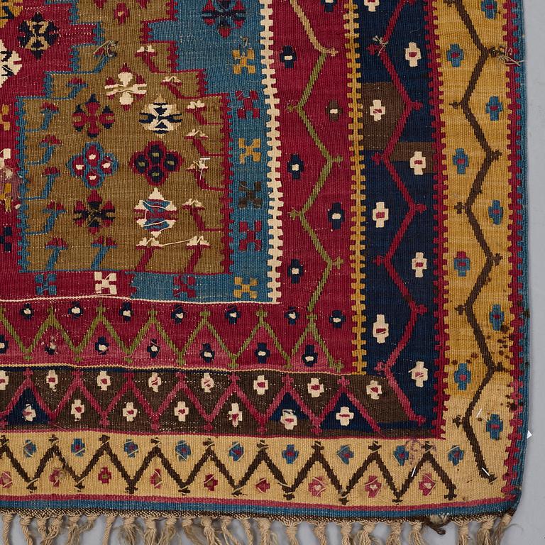 A KILIM, two parts, an antique Reyhanlı, south east Anatolia, ca 290,5 x 79,5 cm and ca 289 x 76 cm.