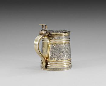 A RUSSIAN SILVER-GILT TANKARD, unidentified makers mark, Moscow 1874.