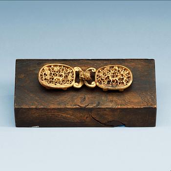 1503. A gilt bronze belt buckle.