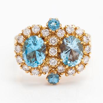 An 18K gold ring "Sophia Albertina" with topazes and diamonds ca. 0.72 ct in total. Ofelia Jewelry, Helsinki 1998.