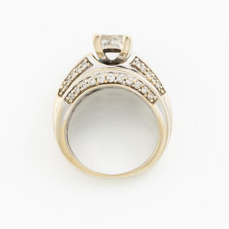 Ring, 14K gold with princess, baguette, and round brilliant-cut diamonds.