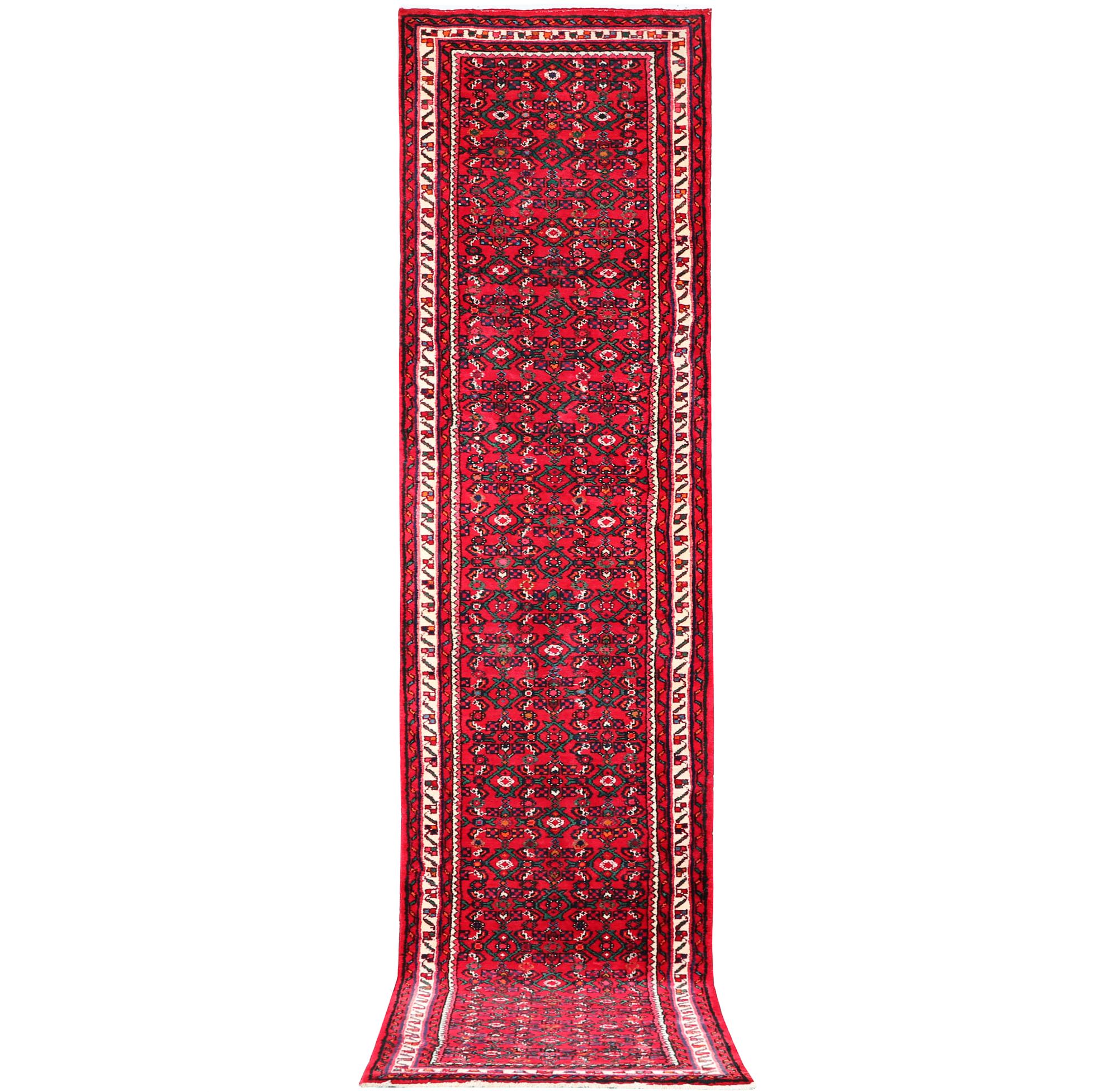 An oriental runner carpet, c. 395 x 87 cm.