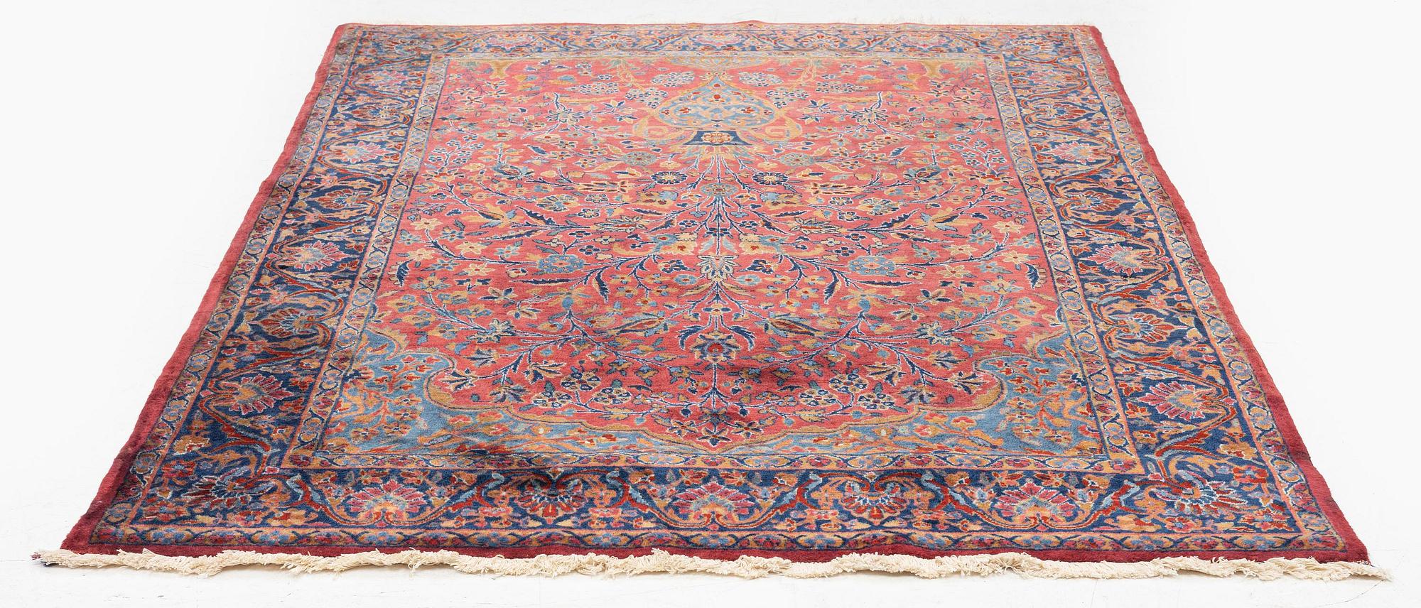 An antique Manchester Kashan rug, c. 197 x 126 cm.
