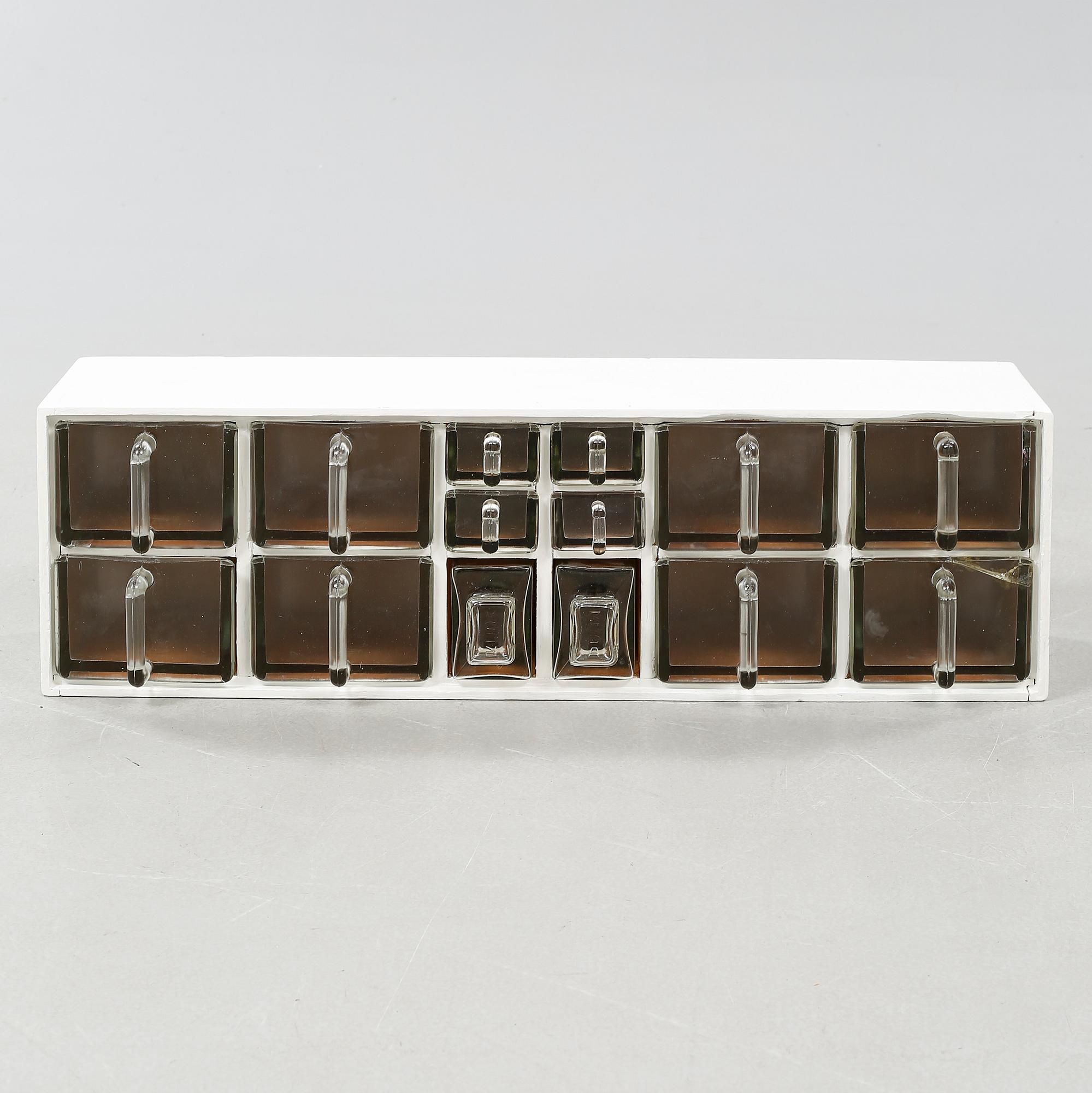 A spice rack from around the middle of the 20th century.