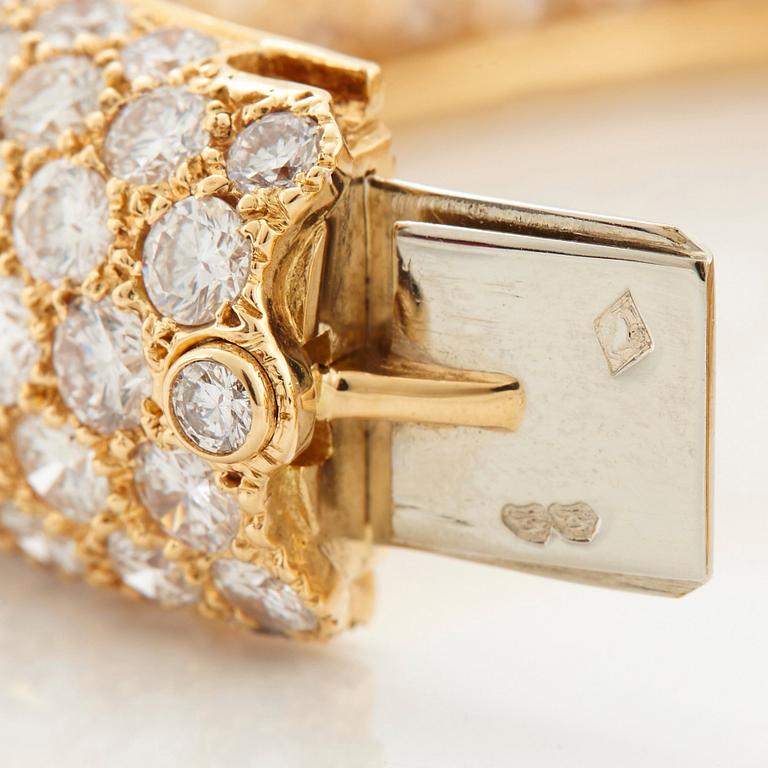 Cartier armring 18K guld med runda briljantslipade diamanter.