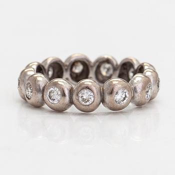 An 18K white gold eternity ring, with brilliant-cut diamonds totalling approximately 0.39 ct.