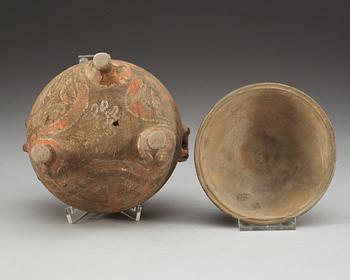 A potted ding tripod censer with cover, Han dynasty (206 BC - 220 AD).