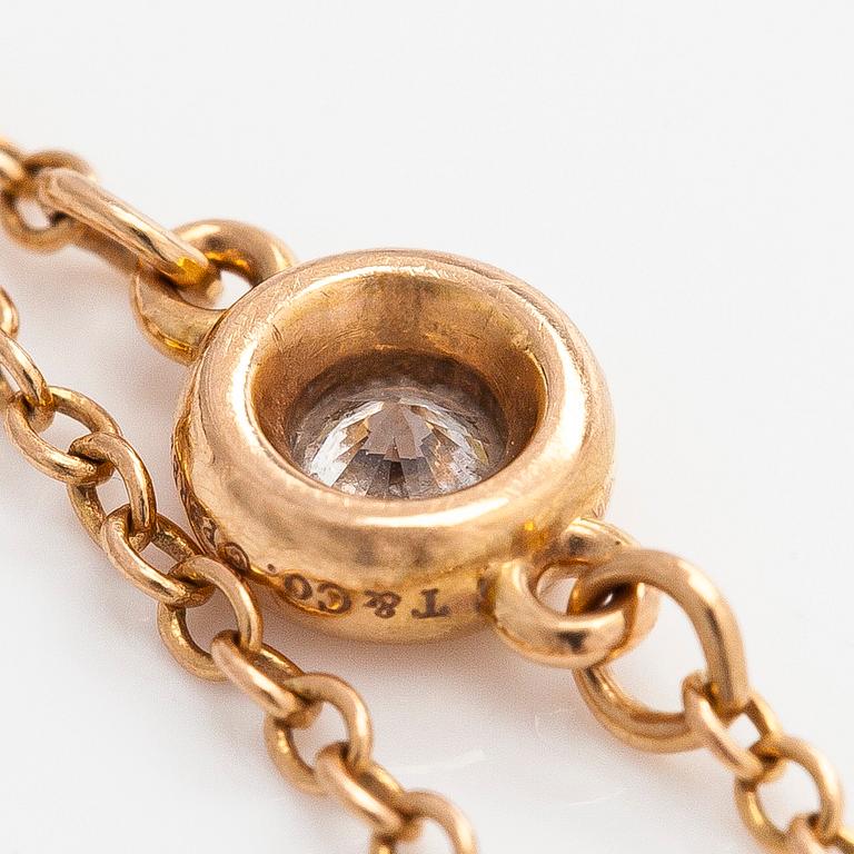 Tiffany & Co, Elsa Peretti, an 18K gold 'Diamonds by The Yard' ring with a brilliant-cut diamond.