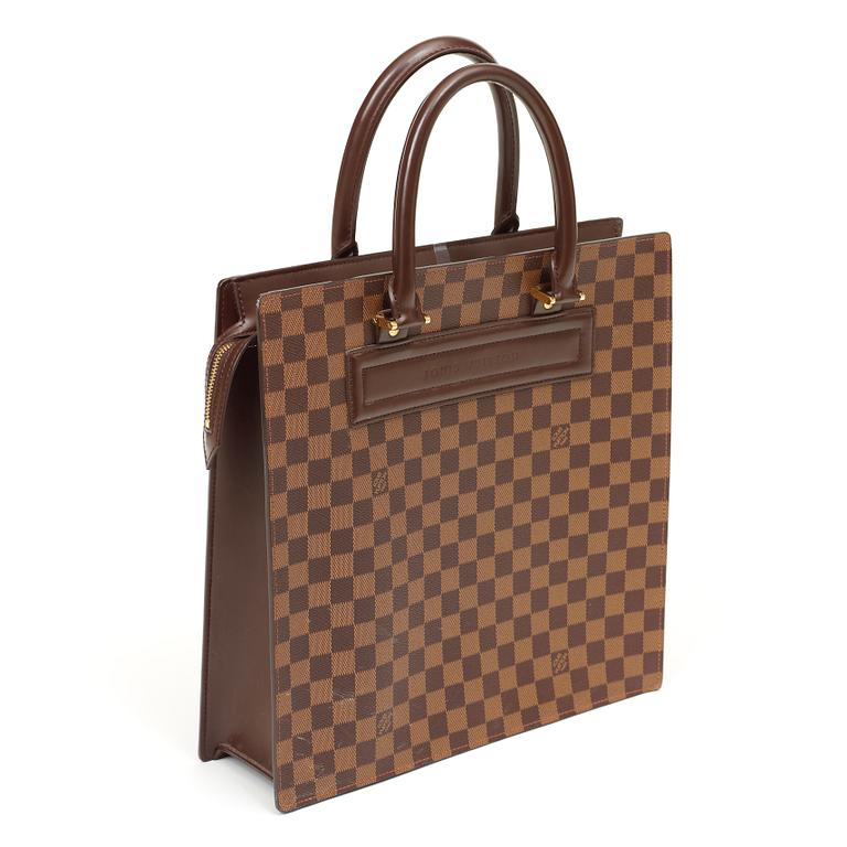 A 1990s damier ebene canvas handbag by Louis Vuitton.