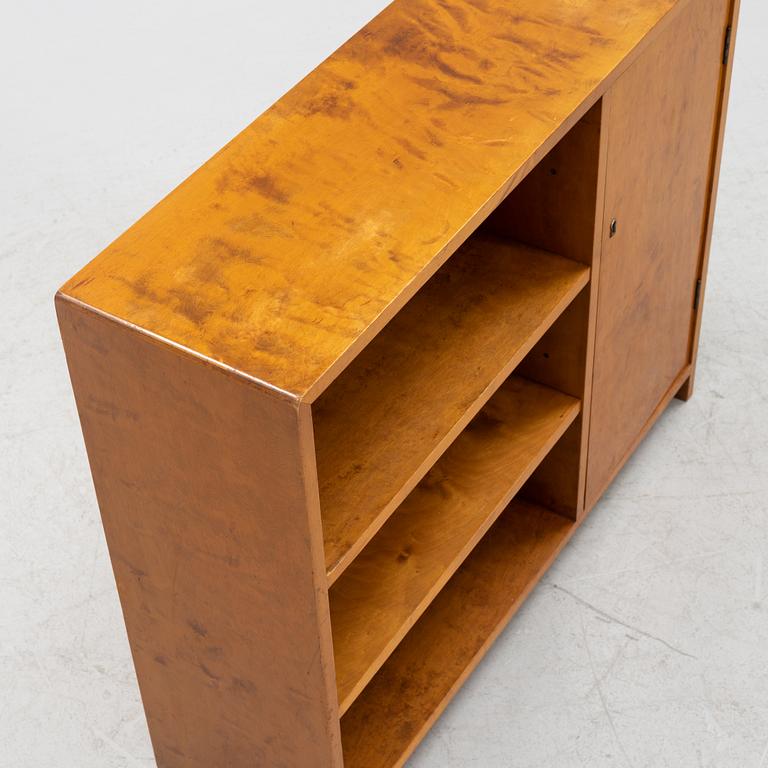 A birch wood book case with cabinet, 1930s.