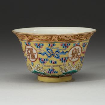 A famille rose yellow ground bowl, Qing dynasty, Guangxu six-character mark in red and of the period  (1875-1908).