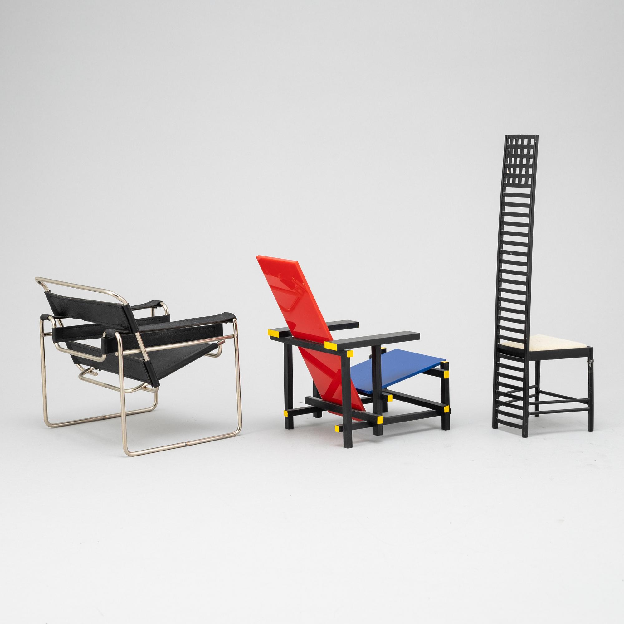 Miniatures of three famous design chairs, 21st century.