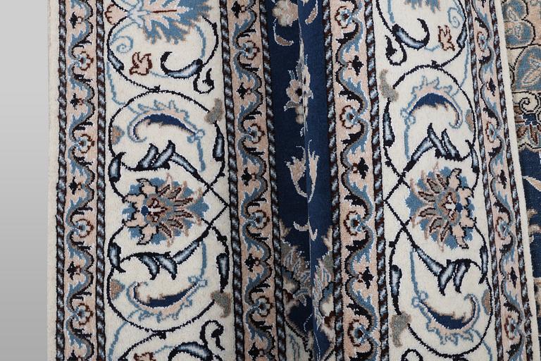 A carpet, Nain, part silk, ca 294 x 198 cm.