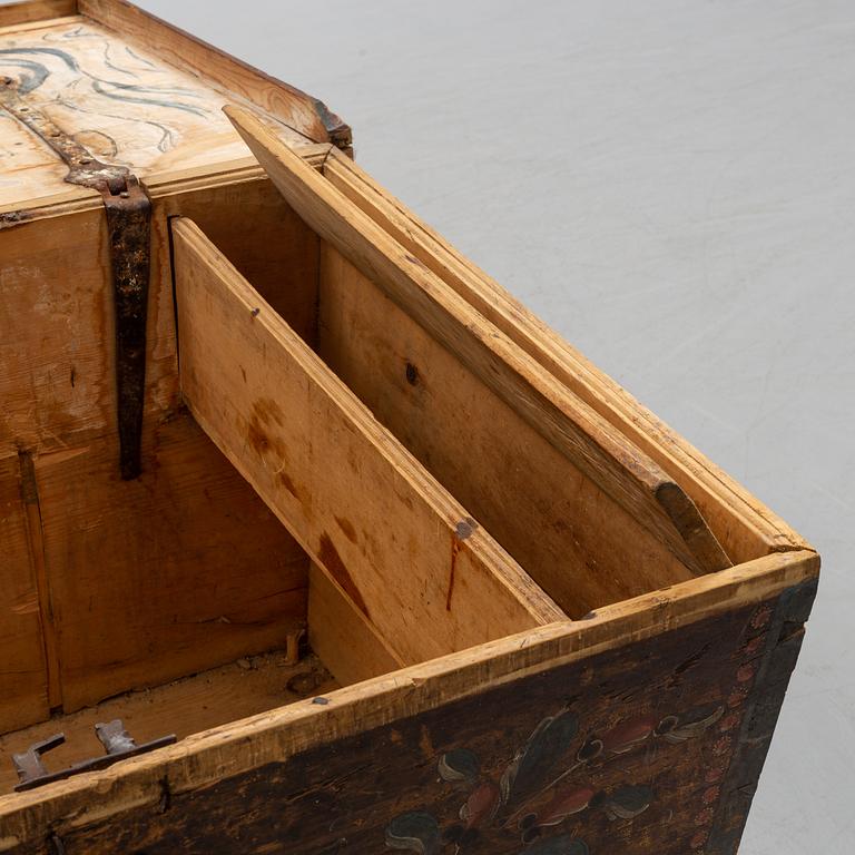 A painted pine chest from Bjuråker, Hälsingland, dated 1828.