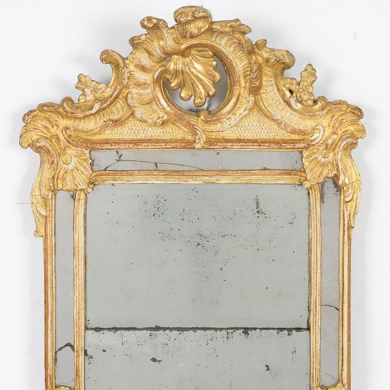 A giltwood rococo mirror, Stockholm, later part 18th century.