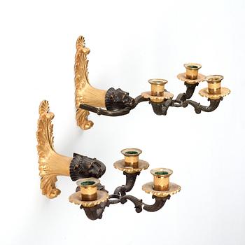 A pair of late Empire 1820's three-light wall-lights.