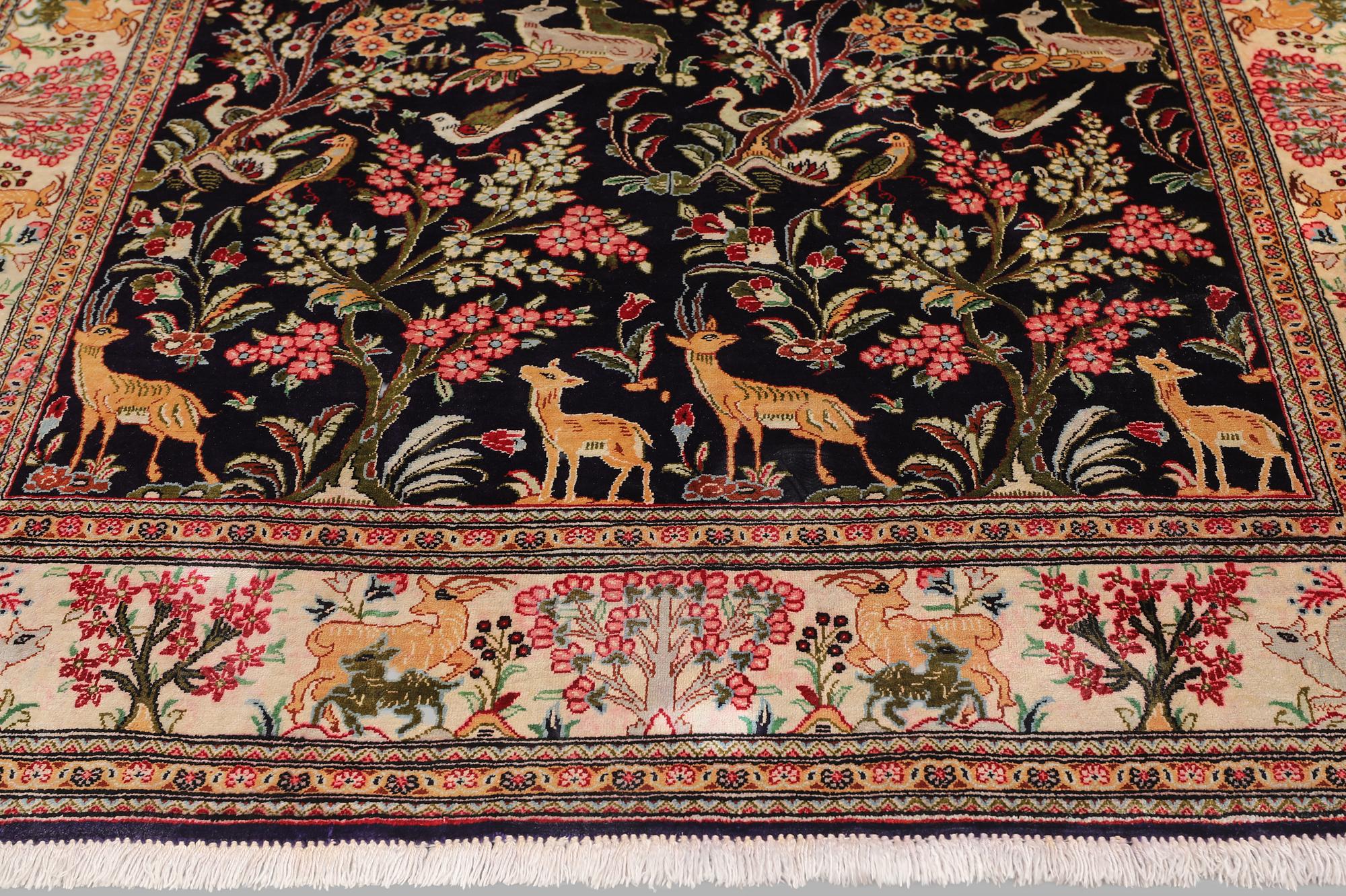 A silk Ghom rug, 155 x 100 cm.
