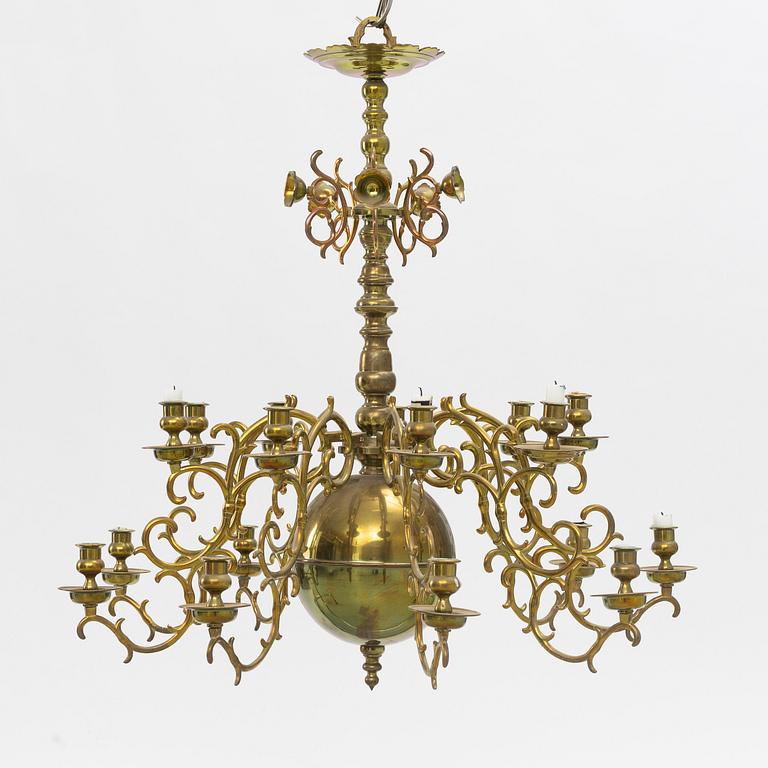 A baroque-style brass eighteen-branch chandelier, late 19th century.