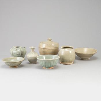 A group of seven pale olive green South East Asian ceramics, songstyle, 20th Century.