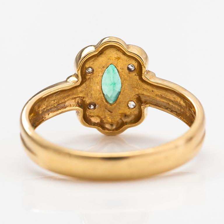 An 18K gold ring with diamonds ca. 0.02 ct and an emerald. Finnish import marks.