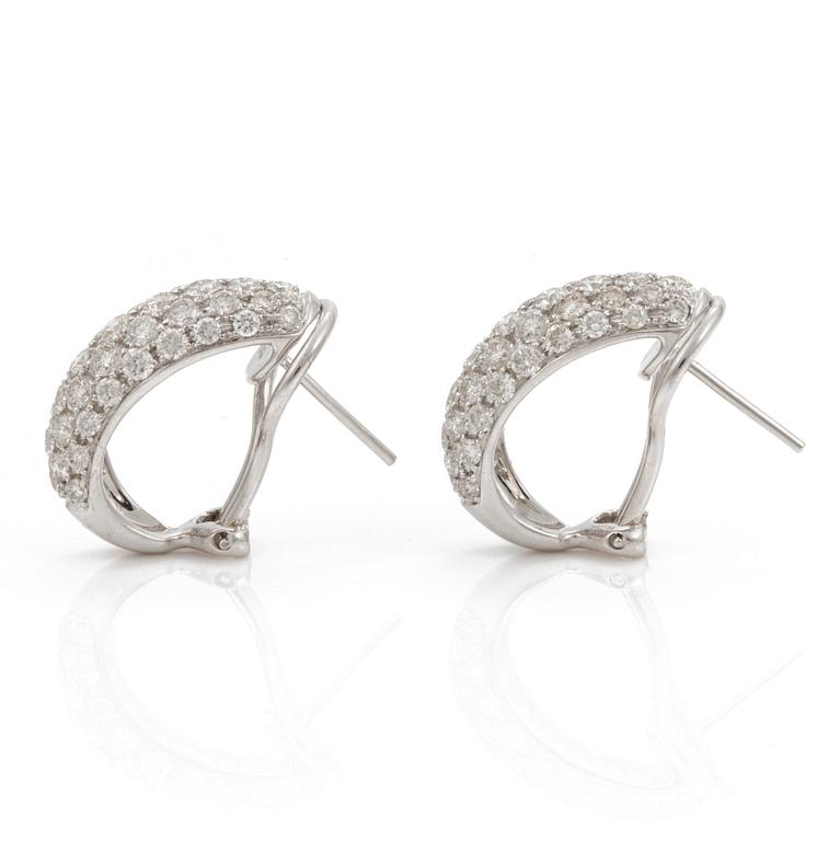 A pair of brilliant cut diamond earrings. Total carat weight 2.79 cts according to engraving.