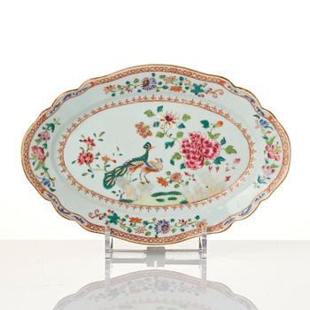 A group of famille rose 'double peacock' serving dishes, Qing dynasty, Qianlong (1736-95). (8 pieces).